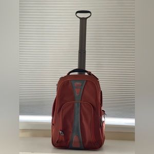 Orange Tumi backpack/Carryon roller bag
